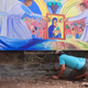 A drug surrenderer works on a mural at the Baclaran as part of the church’s livelihood program to support victims of the drug war.